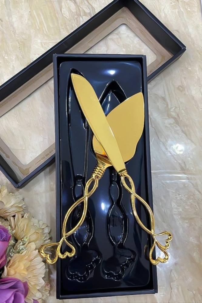A luxurious golden cake cutting set with a carrier — product image 1