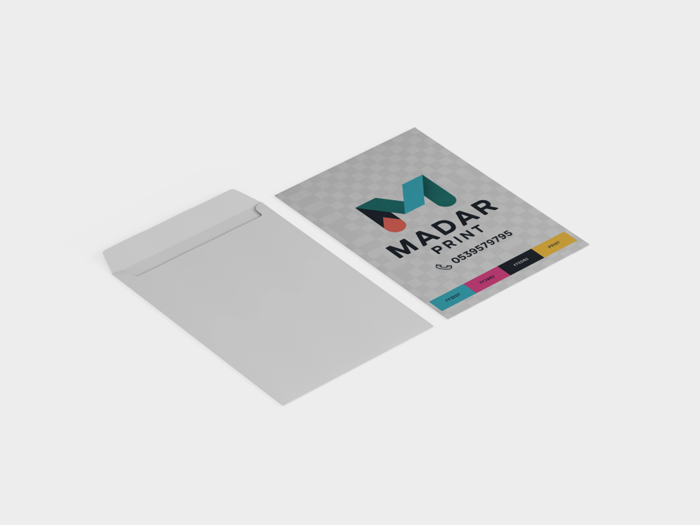 White envelope and colorful business card from Madar Print, featuring contact details and logo.