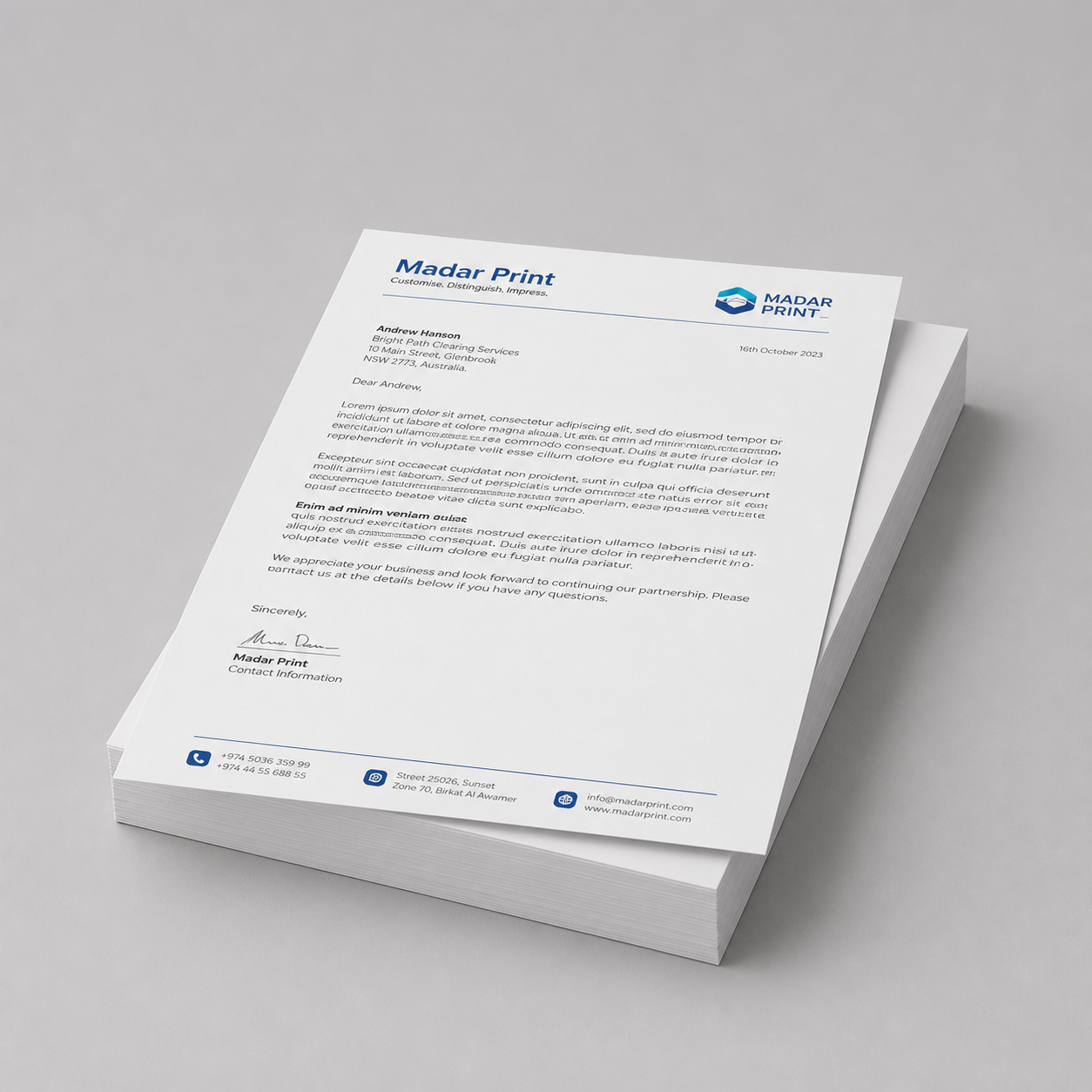 Stack of custom corporate letterheads shown from a low angle