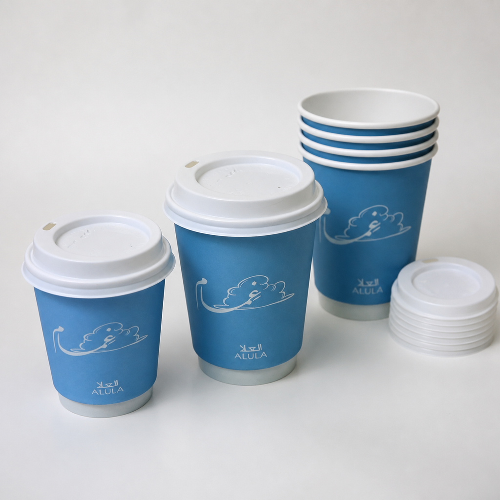 Custom printed paper cups displayed in two sizes with stacked cups and lids