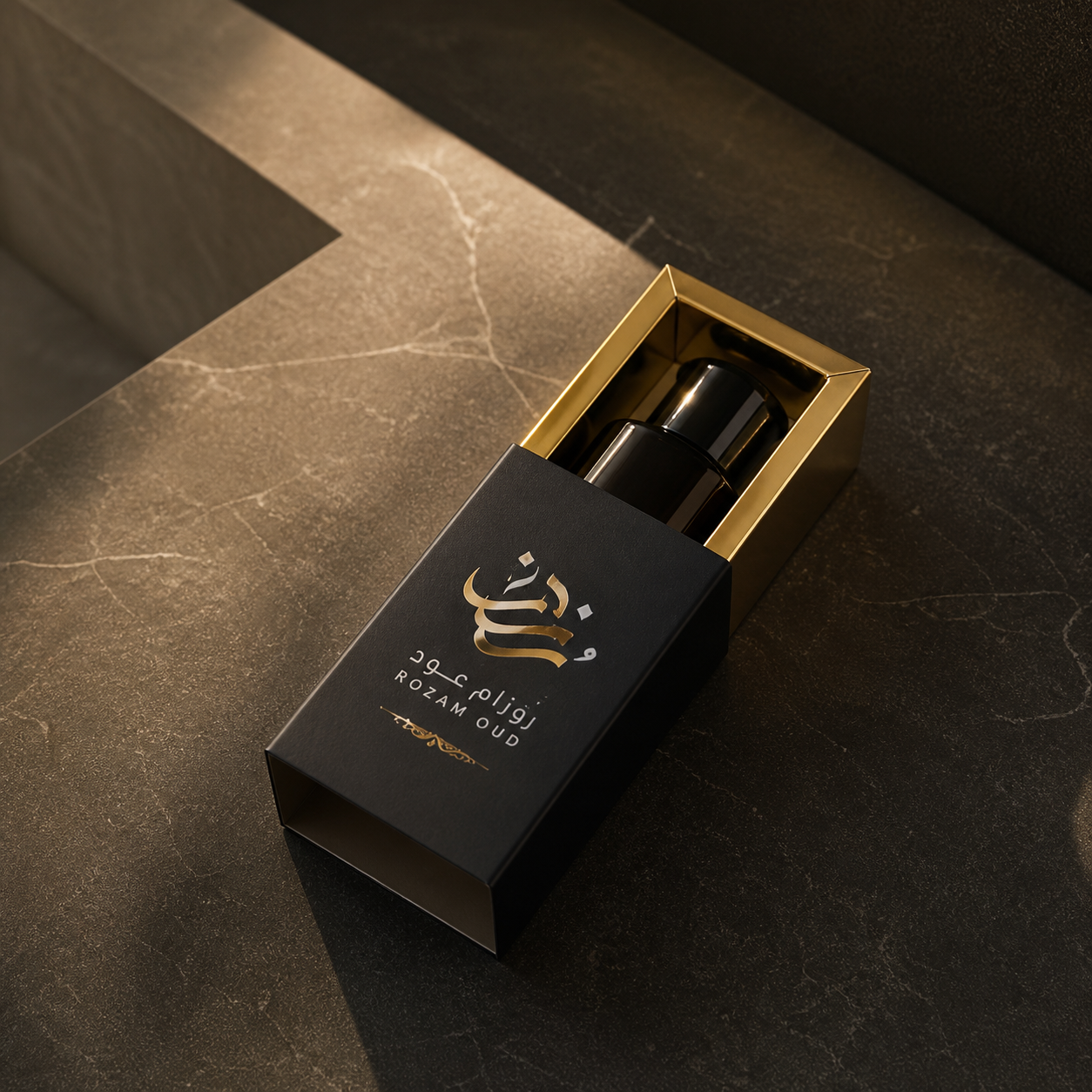 Custom printed oud box open with metallic base and oud bottle