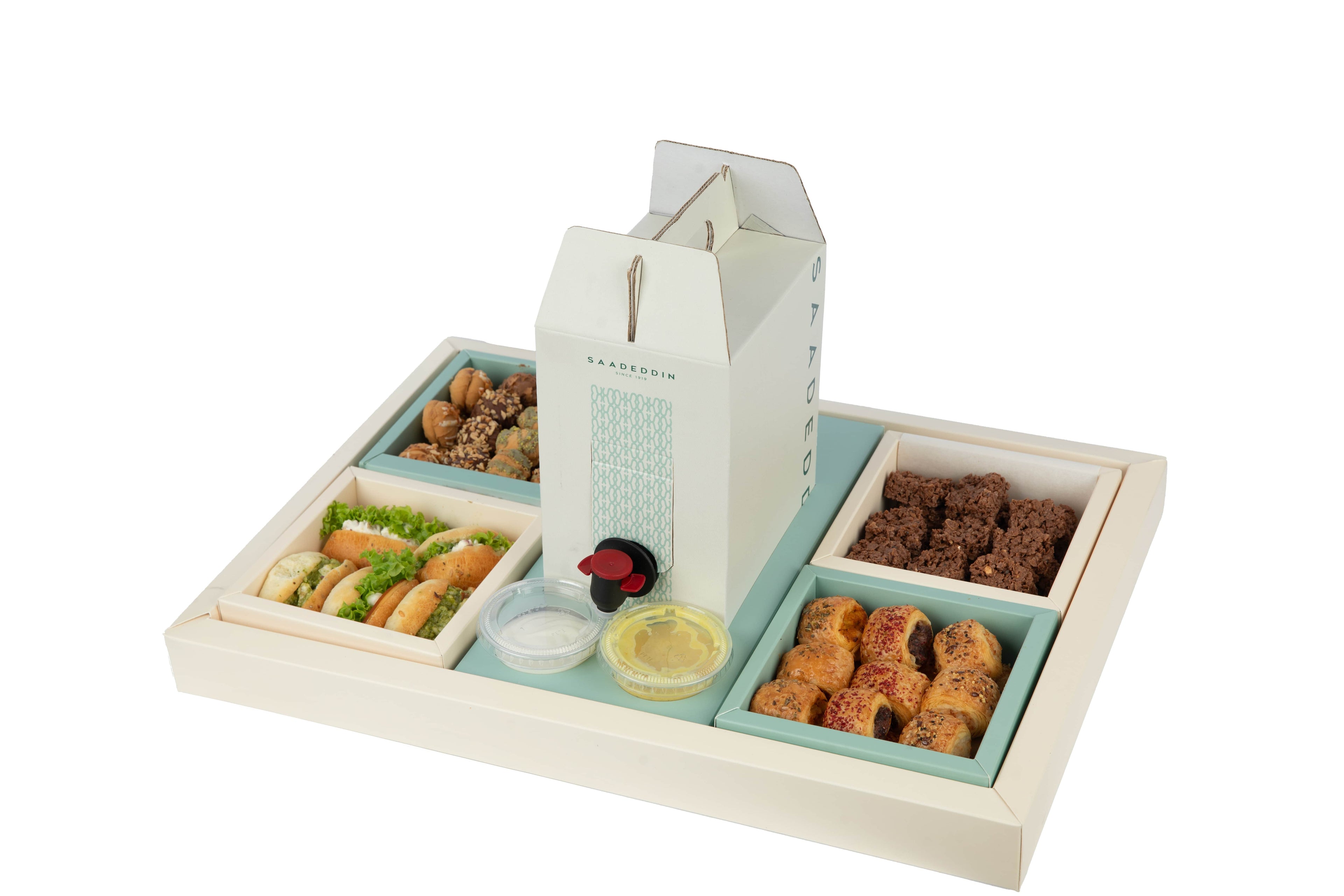 Large catering box reference with four separate food trays, sauce cups and central drink dispenser